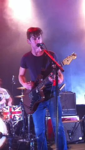 Alex Turner Performing with Arctic Monkeys