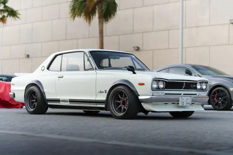 Vintage Nissan Skyline GT-R parked outdoors in Saudi Arabia, showcasing its timeless design.