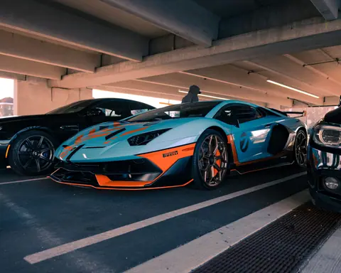 Custom blue and orange racing car parked in a Philadelphia parking garage.