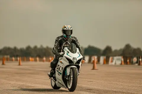 Motorbike racer captured mid-action during a race in Bengaluru, India.