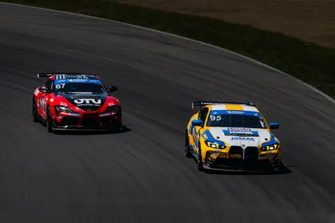 Exciting car race with vibrant sports cars on a Lexington, Ohio track.