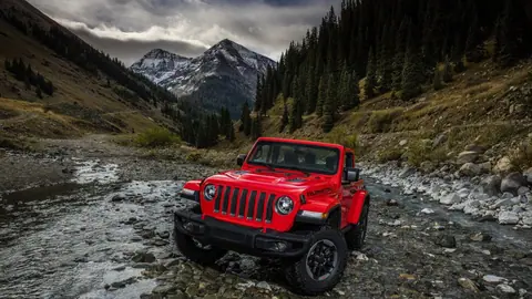 Red Jeep Wrangler in Rugged Mountain River Landscape - backiee