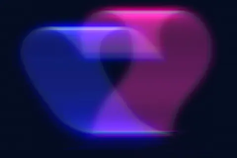 A colorful abstract heart shape in vibrant neon colors with a blurred motion effect.