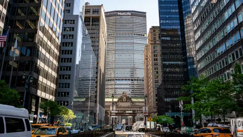 Dynamic view of Grand Central Terminal and MetLife Building in Manhattan, capturing urban life and architecture.