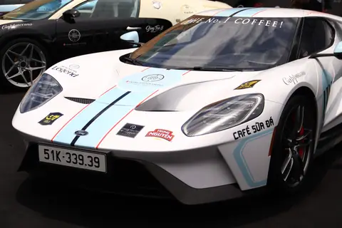 A sleek, branded sportscar showcased with luxury details and vivid aesthetics.