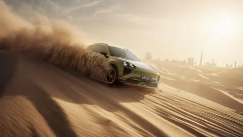 Porsche Cayenne Storming Desert Dunes in Golden 4K Light - backiee