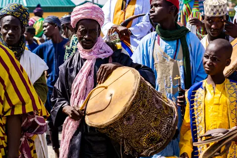 Vibrant cultural festival showcasing traditional African drumming and colorful attire.