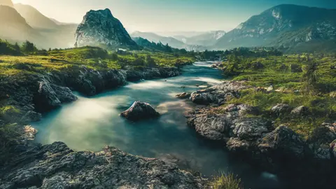 Emerald Highland River Winding Through Rocky Summits in Soft Morning Light - backiee