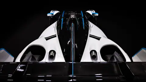 A stunning top-down view of a sleek, aerodynamic race car with black, white, and blue accents.