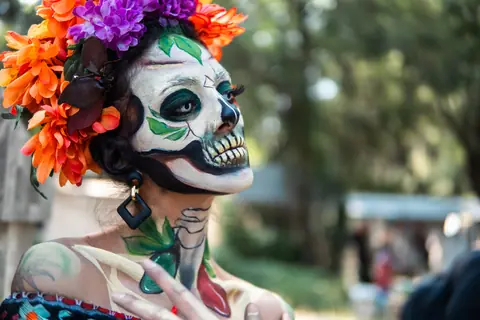 Colorful portrait of a woman dressed as a Catrina for Día de los Muertos in Mexico City.