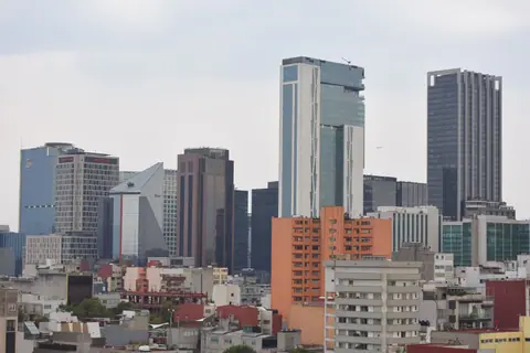 A stunning view of the Mexico City skyline featuring modern skyscrapers in the downtown area.
