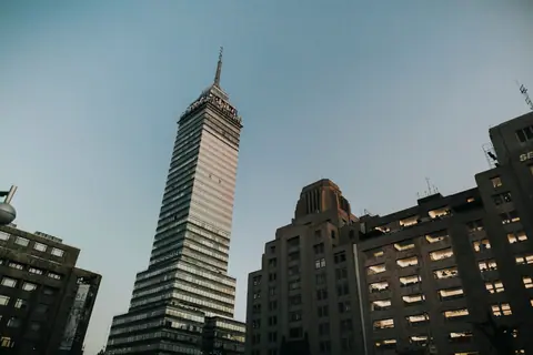 View of the Torre Latinoamericana towering over Mexico City's urban skyline.