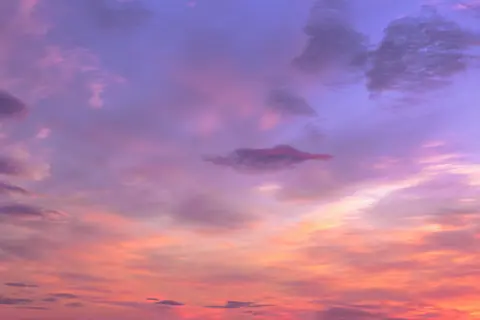 A breathtaking pastel sky with vibrant clouds at sunset, evoking tranquility and beauty.