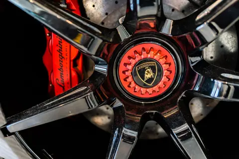 High-detail close-up of a Lamborghini wheel rim showing luxury and precision engineering.