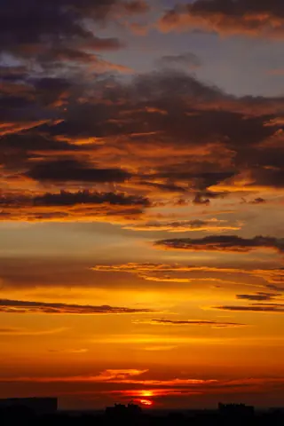 Vibrant sunset casting warm colors over the Saint Petersburg skyline, Russia.