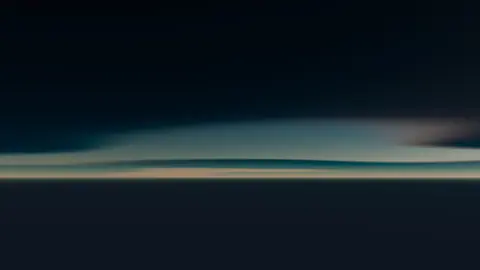 Serene abstract seascape with soft gradient sky and horizon view.