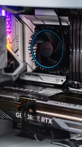 Close-up of a gaming PC showcasing GeForce RTX graphics card and Intel CPU fan.