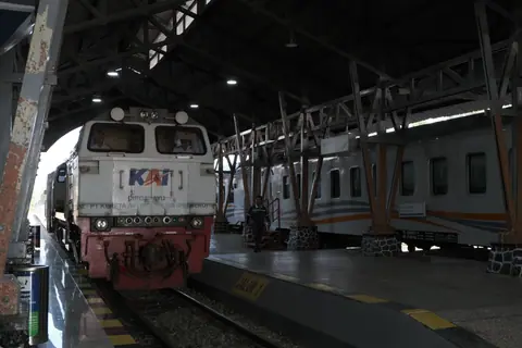 Train at Jakarta station in Indonesia showcasing local rail transport.