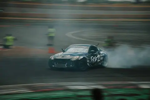 Exciting drift racing action captured with a Nissan car at a race track in Colorado, USA.