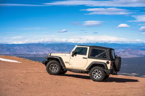 4x4 vehicle on a Colorado mountain with a scenic view.