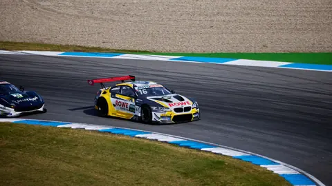 Exciting car race at Hockenheim Circuit, showcasing speed and skill on the track.