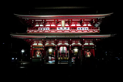 A captivating night photograph of the iconic Senso-ji Temple in Tokyo, Japan, illuminated beautifully.