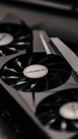 Contemporary specialized electronic black video cards with inscriptions for generating feed of output images to display device placed on table in room